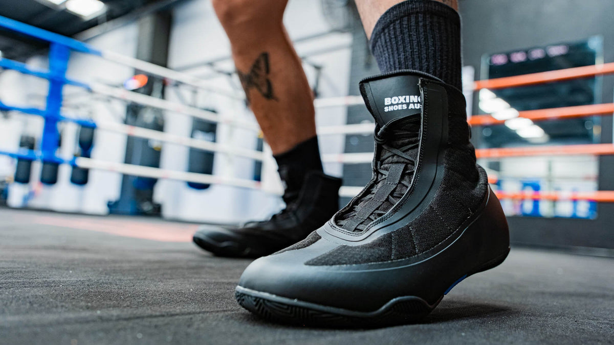 Kickboxer wearing boxing shoes during kickboxing training