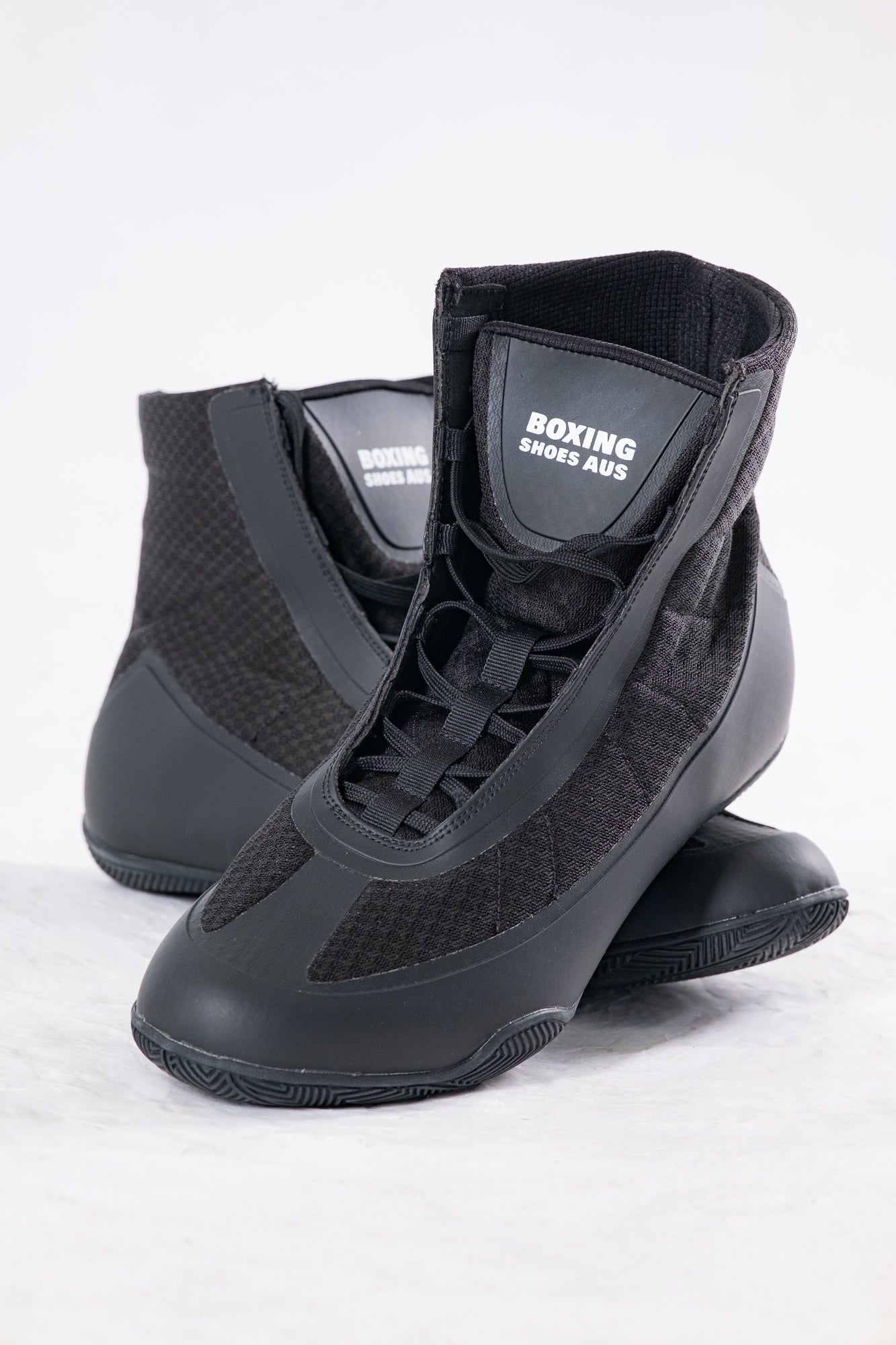 Pair of black boxing shoes with 'Boxing Shoes Aus' branding on a white background